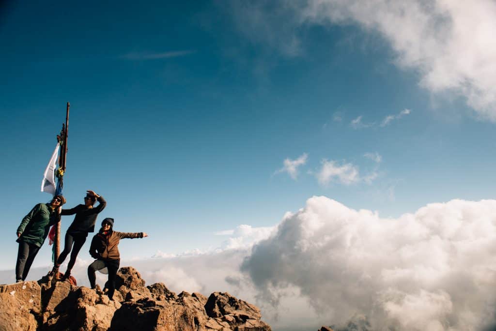 Three girls at the summit of Nevado de Colima