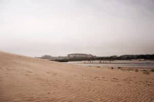 Sand dunes feeding into river Cabo Polonio