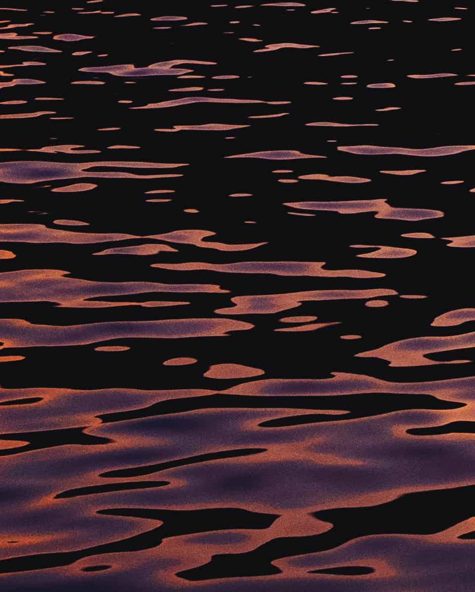 Dark water with purple reflection