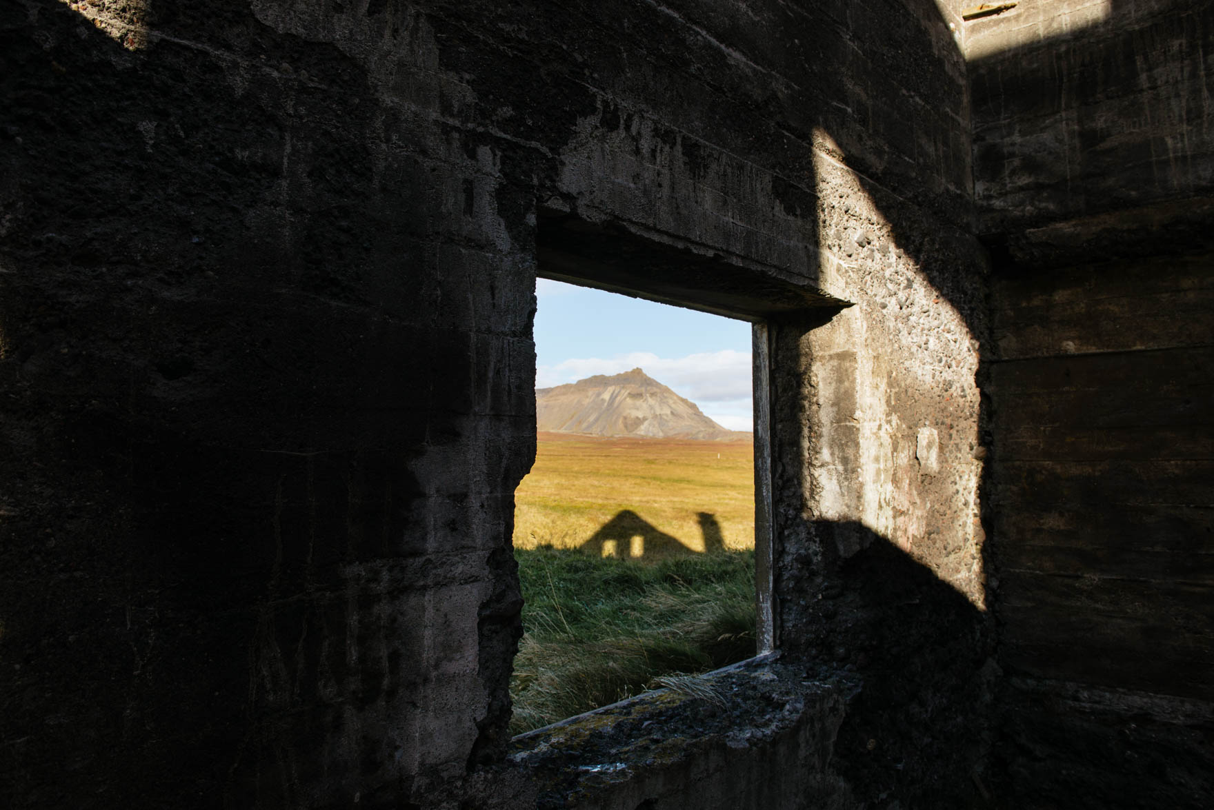 Shadow of house casted onto mountain landscape in Iceland